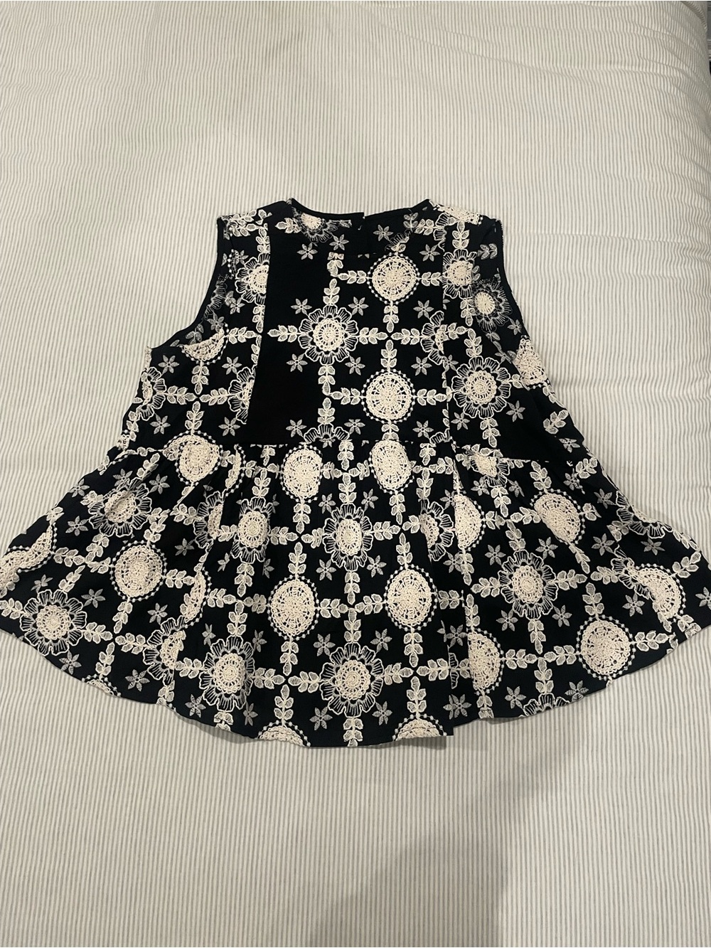 Commense Black Sleeveless Peplum Top with Cream Floral Lace Print
